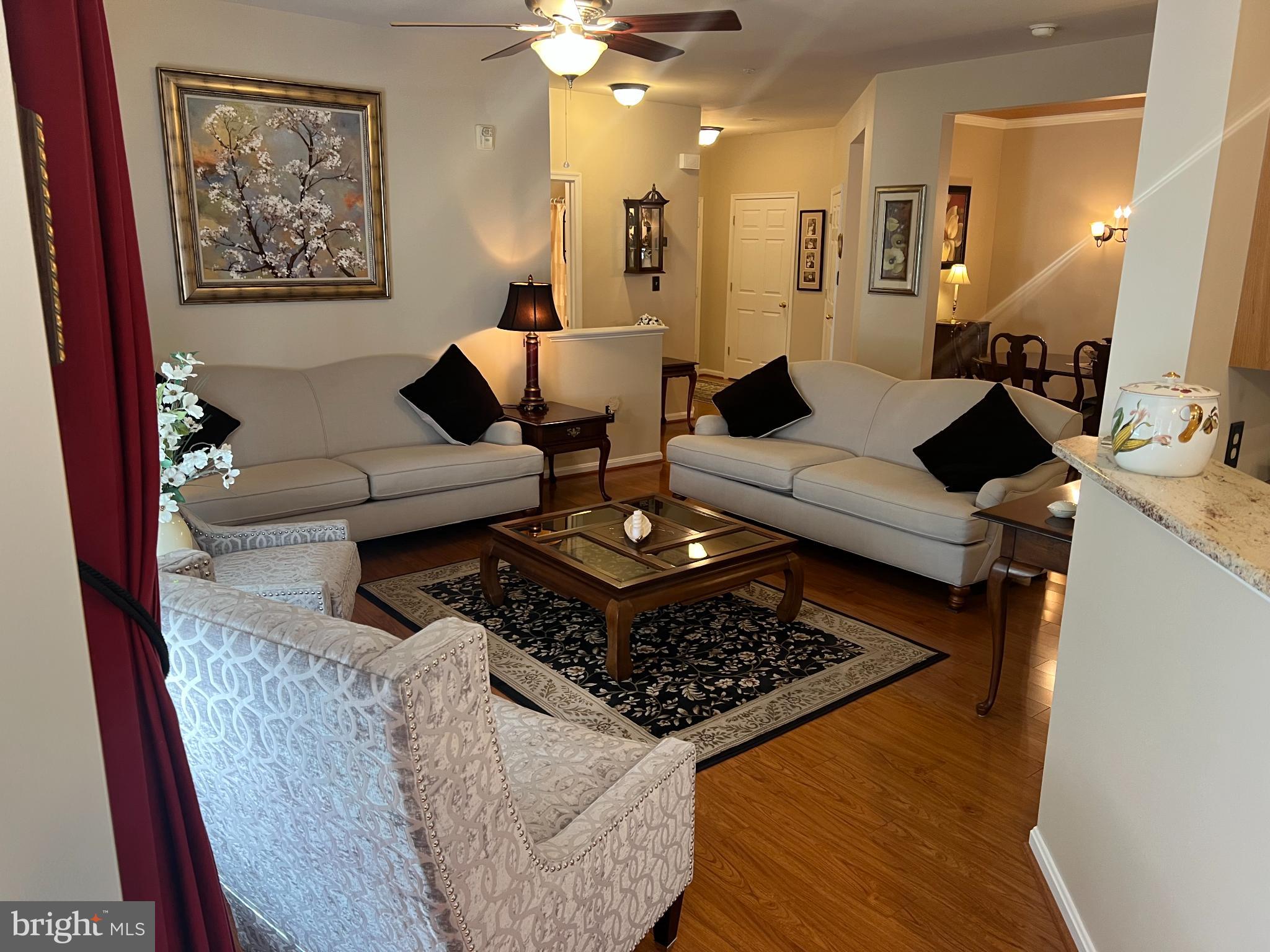 425 Hopkins Landing Drive, Unit 425 Baltimore, MD 21221 - Photo 27 of 43 a living room with furniture and a rug