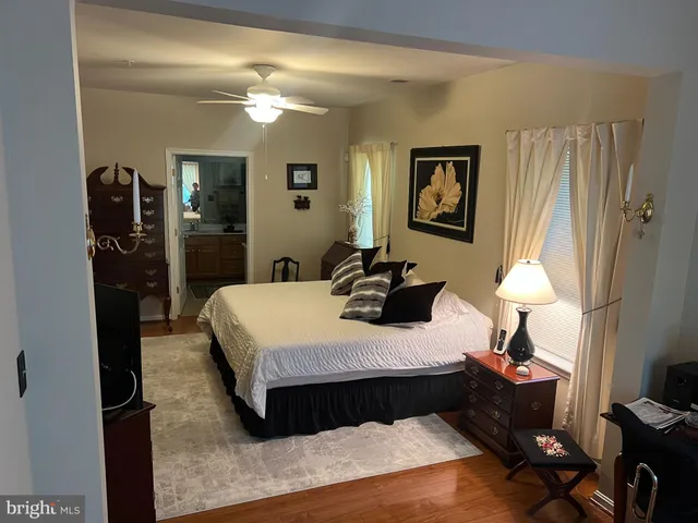 a bedroom with a bed and a lamp