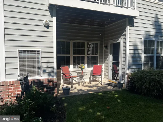 a backyard of a house with seating space