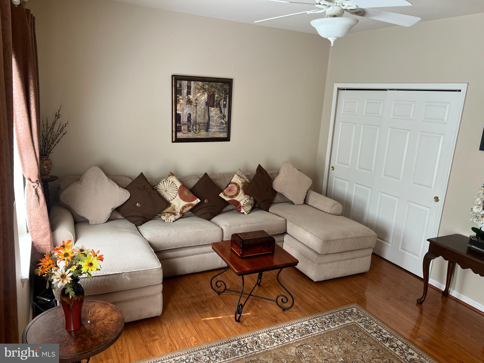 425 Hopkins Landing Drive, Unit 425 Baltimore, MD 21221 - Photo 7 of 43 a living room with furniture flowerpot and wooden floor