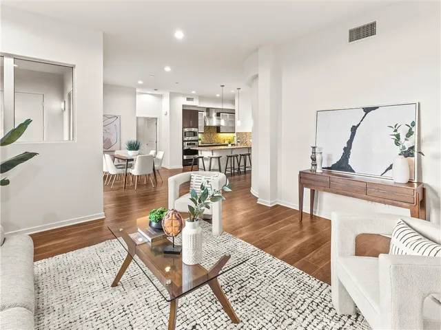 a living room with furniture and a table
