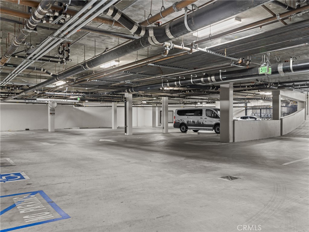 21 Gramercy, Unit 208 Irvine, CA 92612 - Photo 23 of 31 a view of parking garage with cars