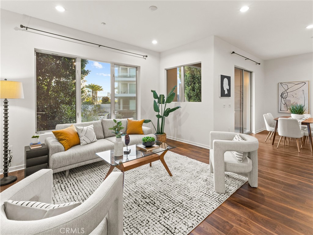 21 Gramercy, Unit 208 Irvine, CA 92612 - Photo 3 of 31 a living room with furniture and a large window