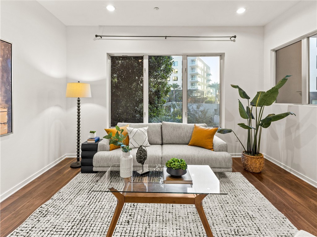 21 Gramercy, Unit 208 Irvine, CA 92612 - Photo 10 of 31 a living room with furniture and a window