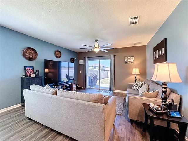 a living room with furniture and a rug