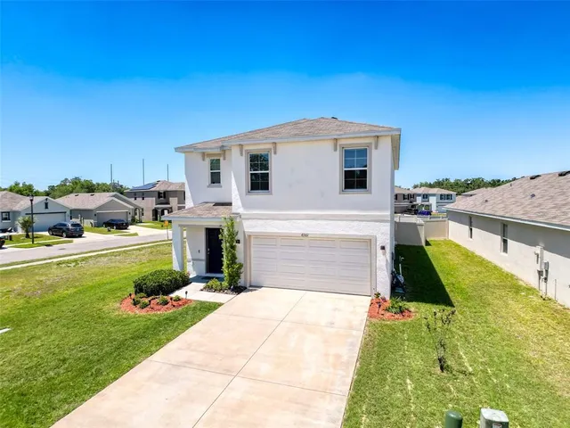 a house view with a garden space