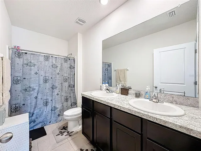 a bedroom with furniture and a bed