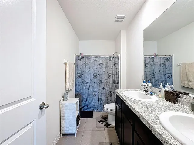 a view of a livingroom with workspace and a couch