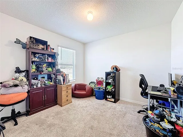 a bathroom with a granite countertop sink toilet and a mirror