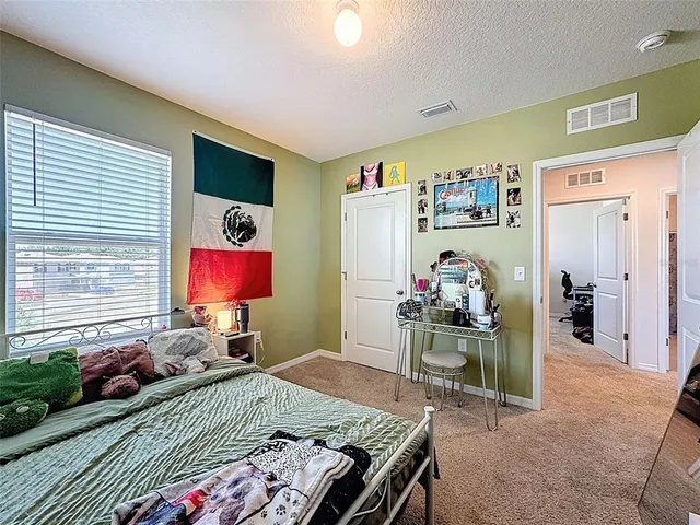 a view of a livingroom with furniture and a flat screen tv