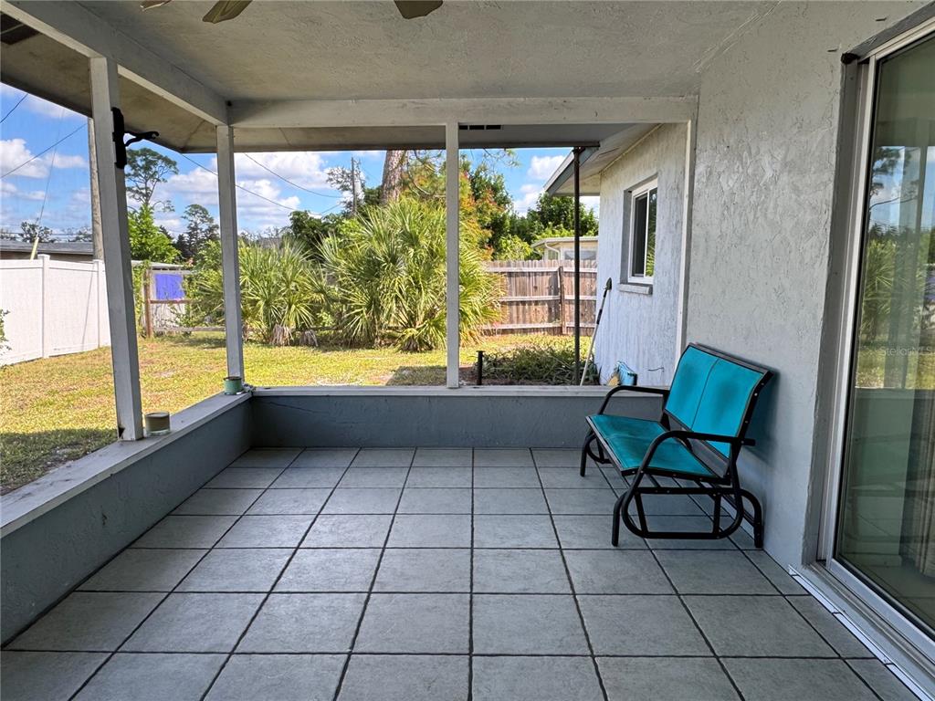 1048 Porpoise Road Venice, FL 34293 - Photo 15 of 26 a view of a room with furniture and a large window