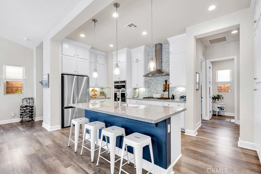 17 Puesto Road Rancho Mission Viejo, CA 92694 - Photo 10 of 69 Enjoy cooking while your guests sit at the kitchen bar.