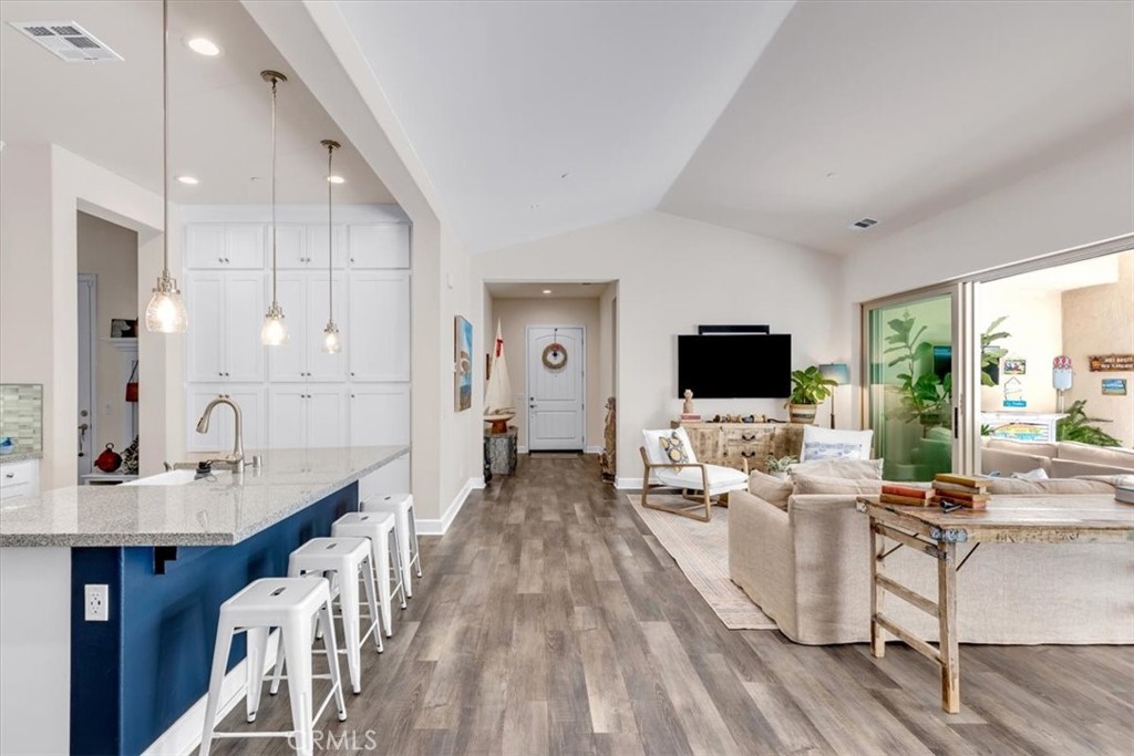 17 Puesto Road Rancho Mission Viejo, CA 92694 - Photo 14 of 69 a living room with furniture a flat screen tv and a large window