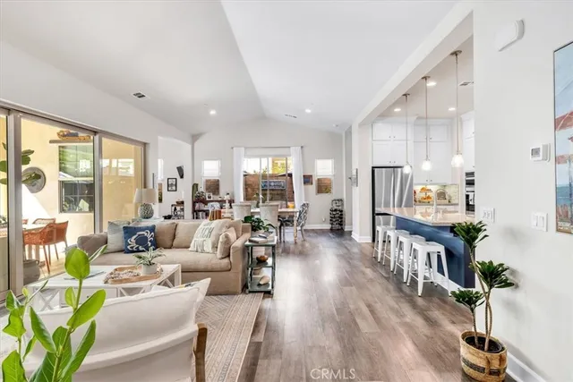 a very nice looking living room with a large window and a flat screen tv