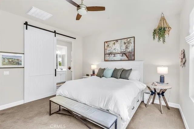 a spacious bathroom with double sink and a mirror