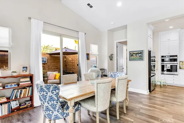 a spacious bathroom with double sink and a mirror