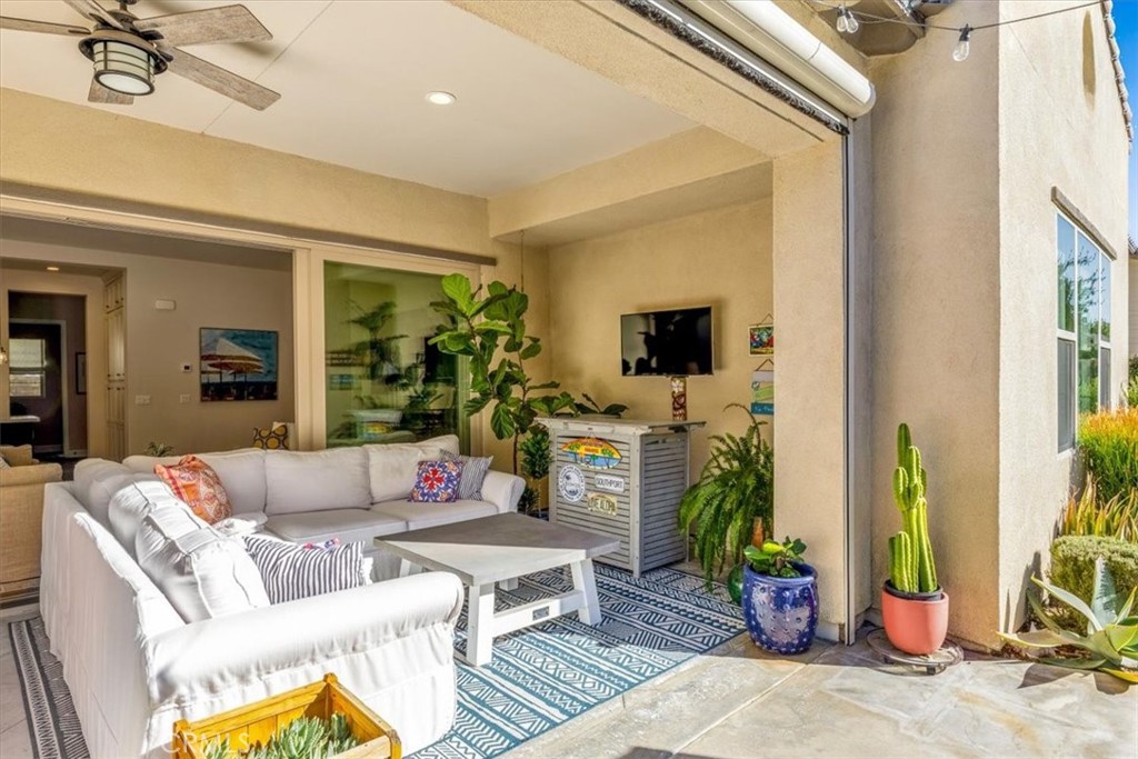 17 Puesto Road Rancho Mission Viejo, CA 92694 - Photo 30 of 69 a living room with furniture and a fireplace