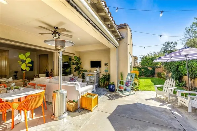 a view of swimming pool with outdoor seating and deck