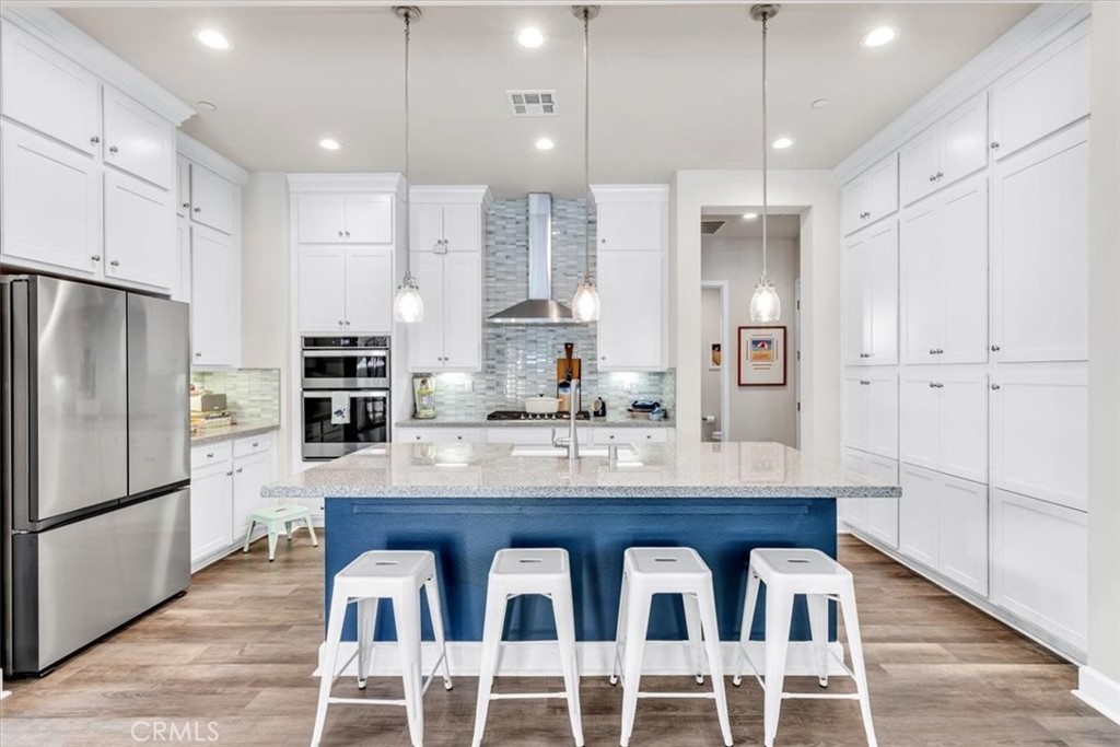 17 Puesto Road Rancho Mission Viejo, CA 92694 - Photo 4 of 69 Gorgeous kitchen with white shaker cabinets and quartz countertops.