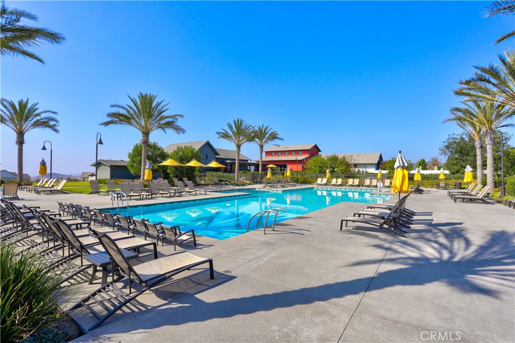 17 Puesto Road Rancho Mission Viejo, CA 92694 - Photo 55 of 69 a view of a swimming pool with a table and chairs