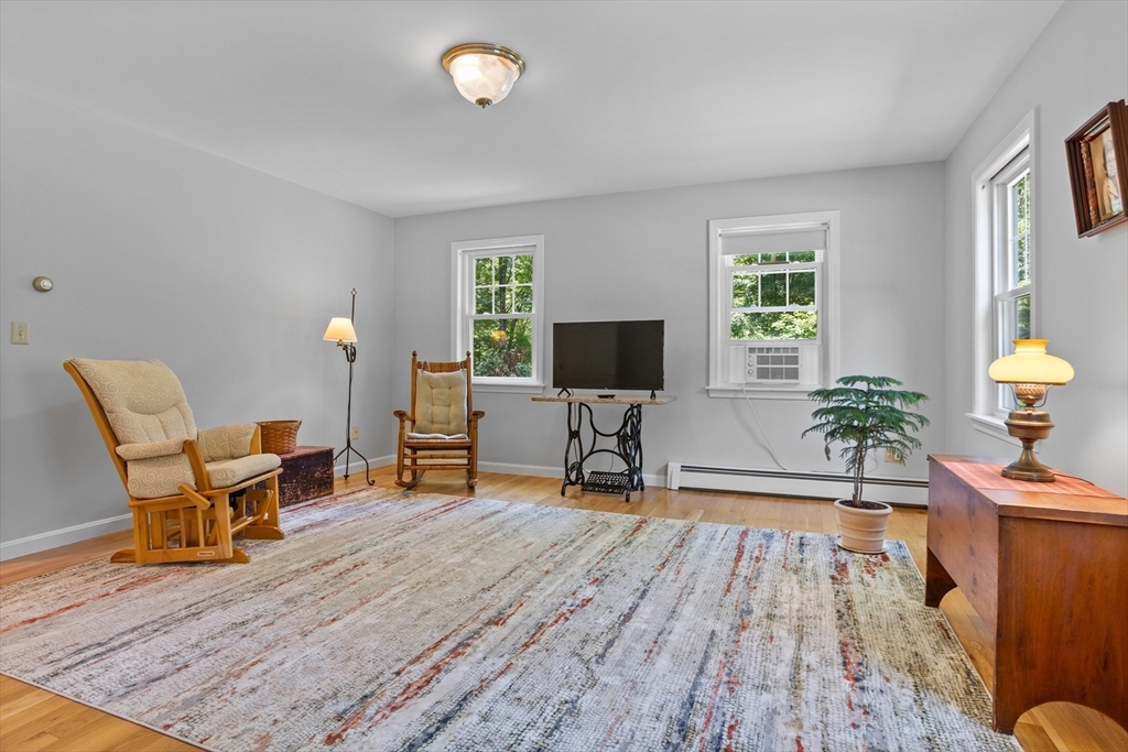 80 Ames Road Groton, MA 01450 - Photo 16 of 40 a living room with furniture and a flat screen tv