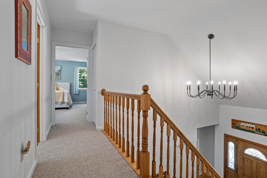 80 Ames Road Groton, MA 01450 - Photo 24 of 40 a view of a hallway view with staircase