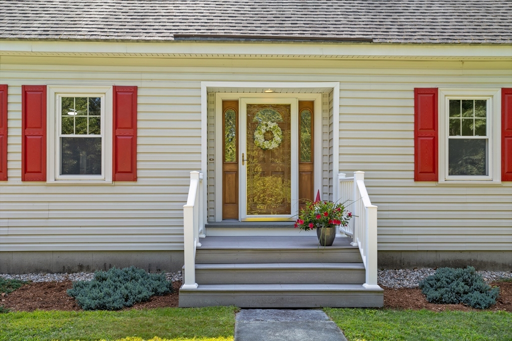 80 Ames Road Groton, MA 01450 - Photo 3 of 40 a front view of a house with a garden