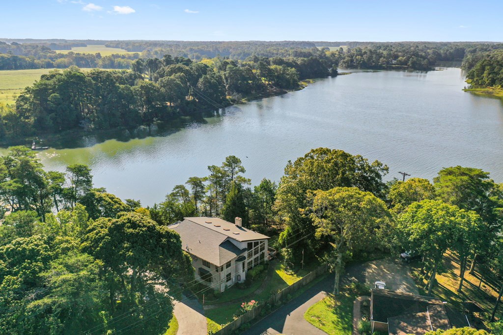 13581 Solitude Trail Machipongo, VA 23405 - Photo 2 of 51 a aerial view of a house with a lake view