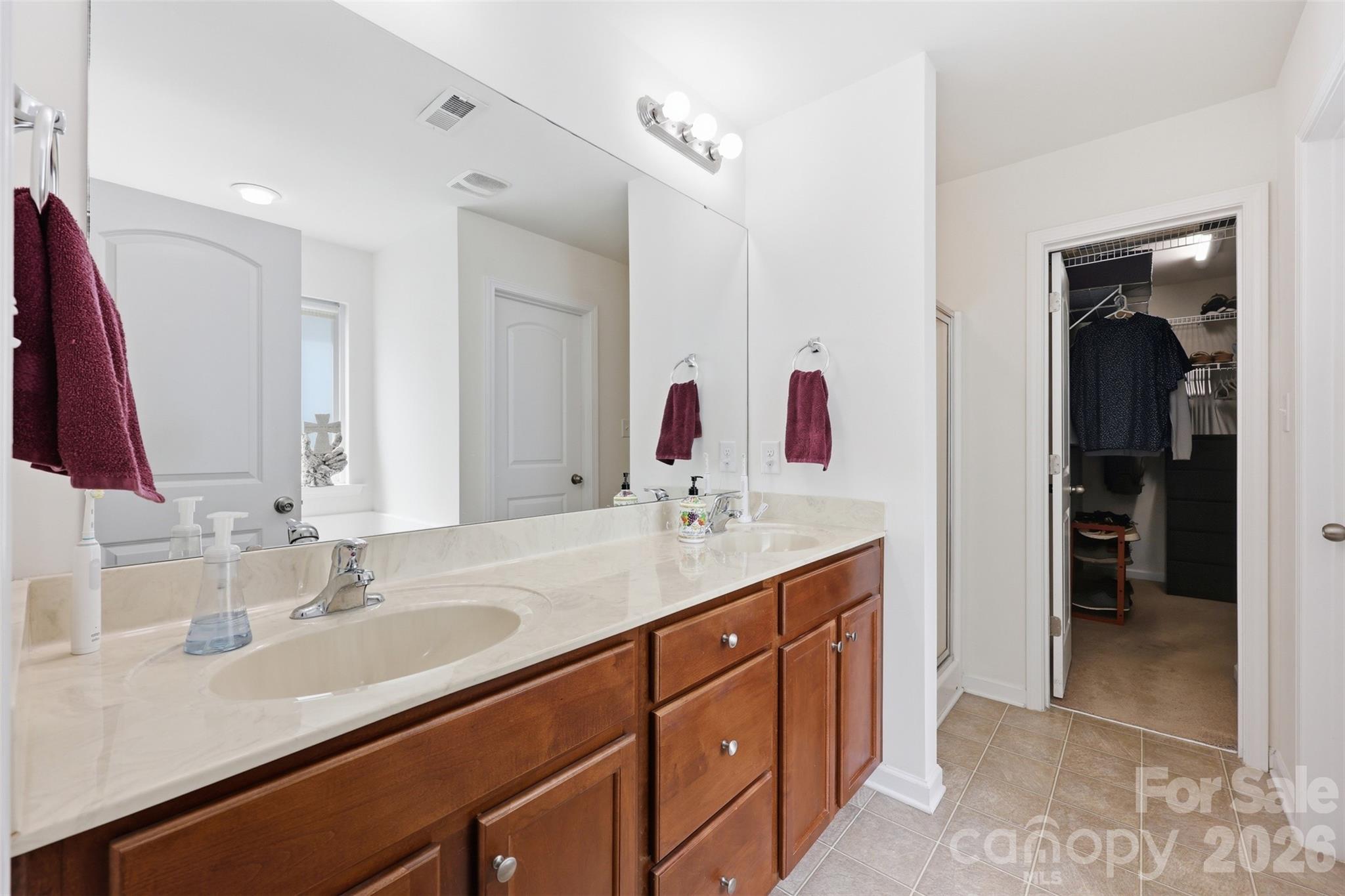 879 Ivy Trail Way Fort Mill, SC 29715 - Photo 13 of 44 a bathroom with a sink and a mirror