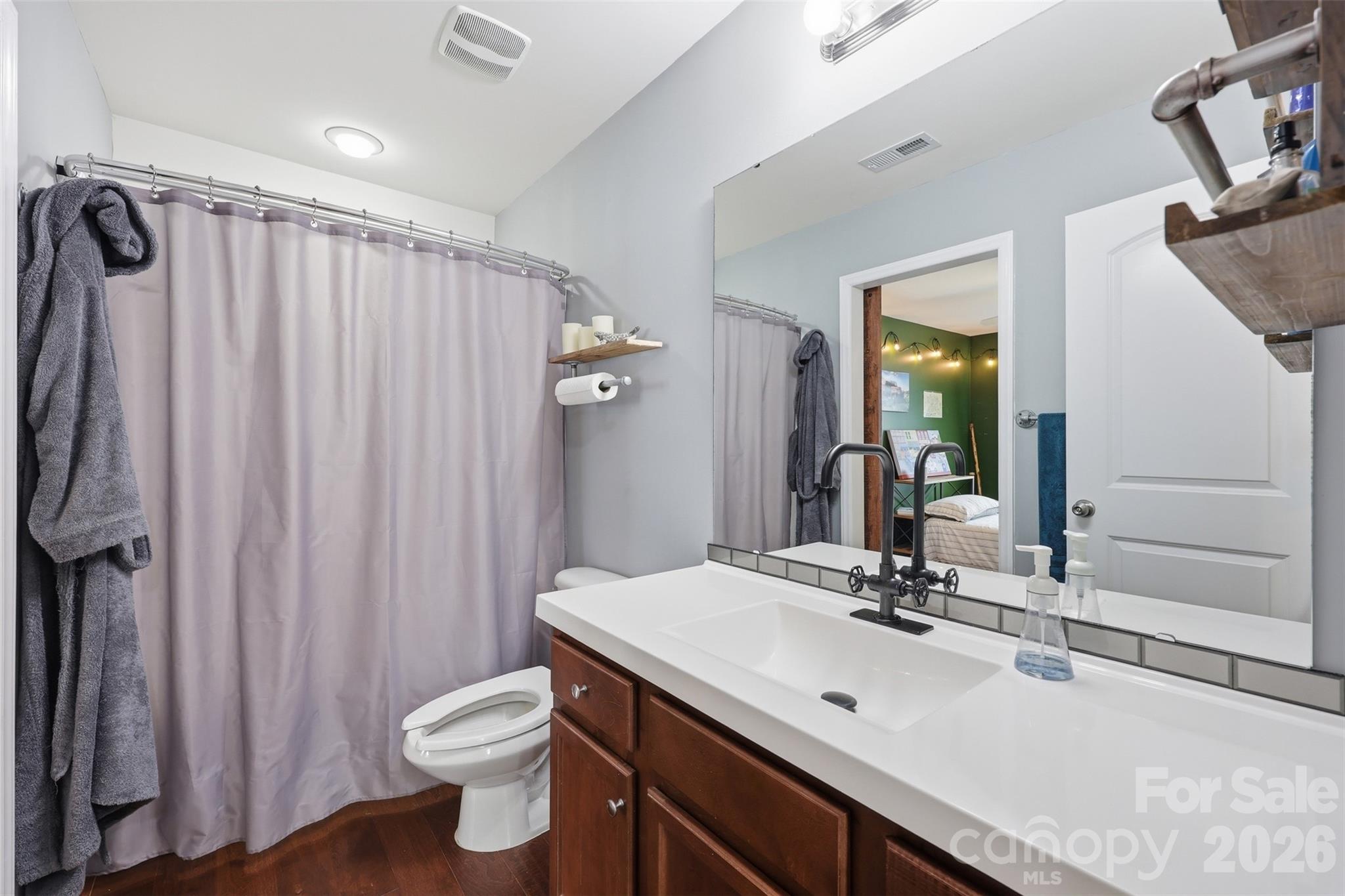 879 Ivy Trail Way Fort Mill, SC 29715 - Photo 18 of 44 a bathroom with a sink a toilet and shower