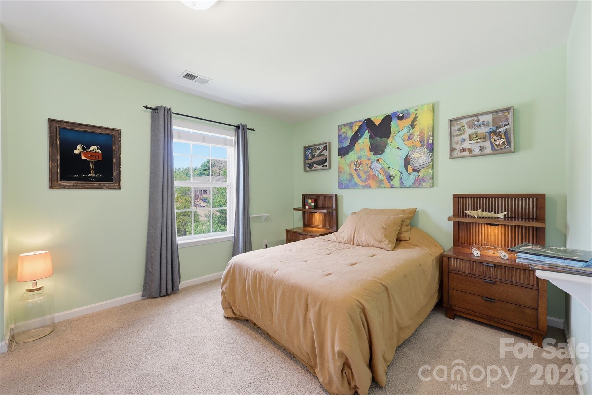 879 Ivy Trail Way Fort Mill, SC 29715 - Photo 19 of 44 a bedroom with a bed and a window