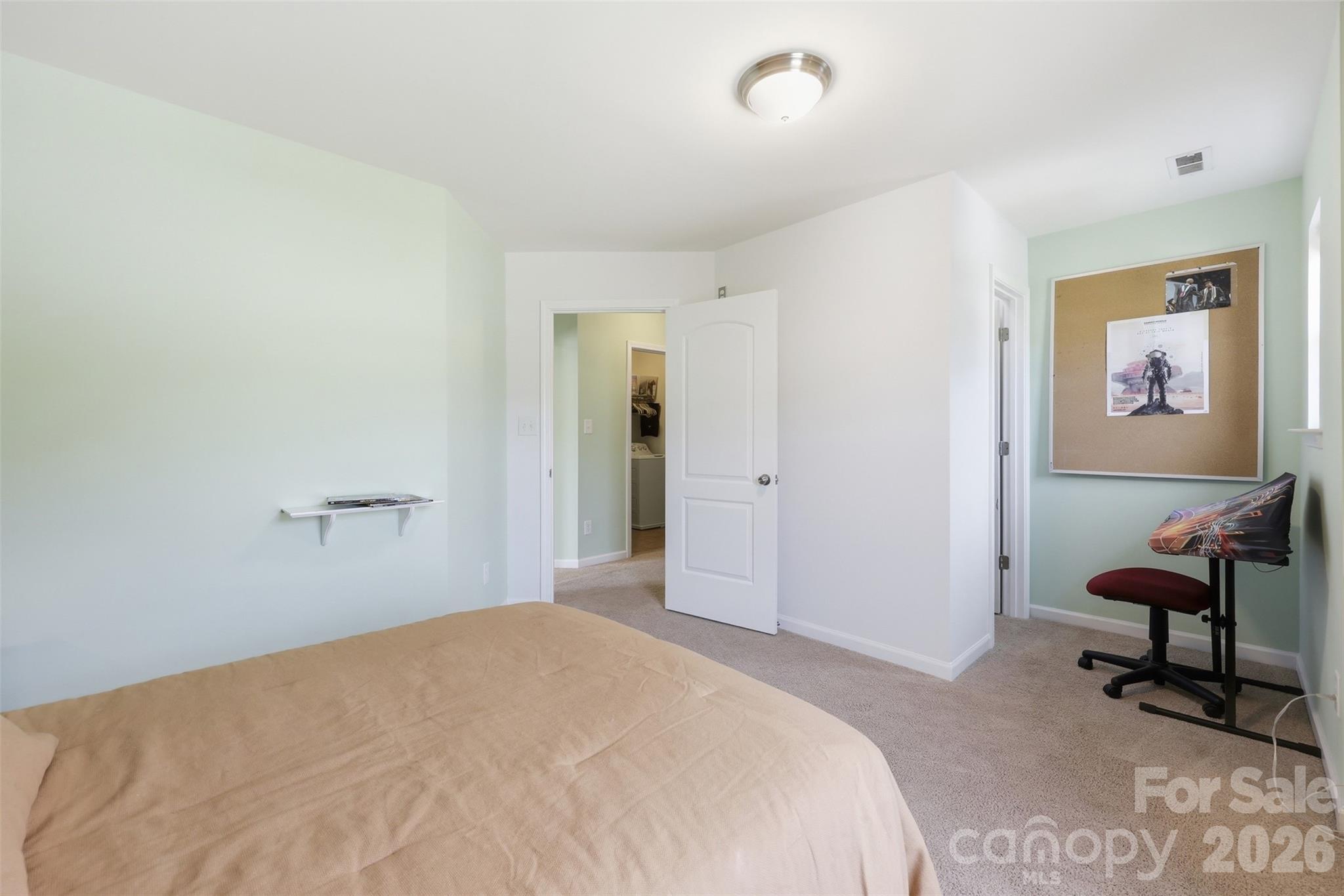 879 Ivy Trail Way Fort Mill, SC 29715 - Photo 20 of 44 a bedroom with a bed and a chair