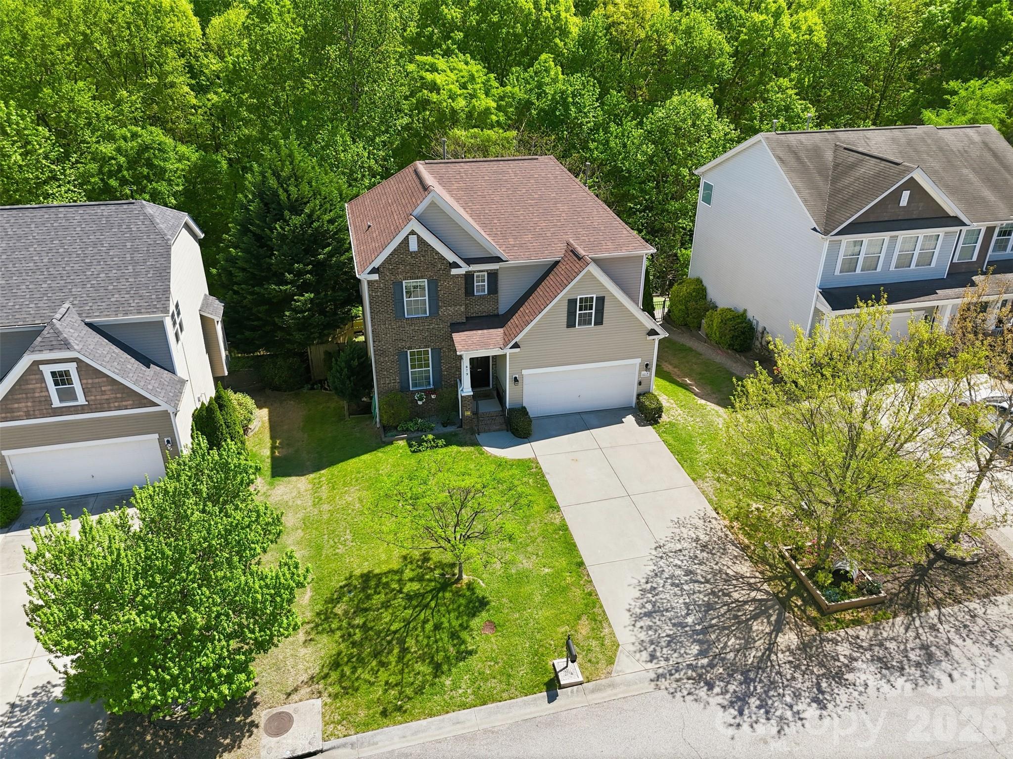 879 Ivy Trail Way Fort Mill, SC 29715 - Photo 32 of 44 a aerial view of a house with a yard and potted plants