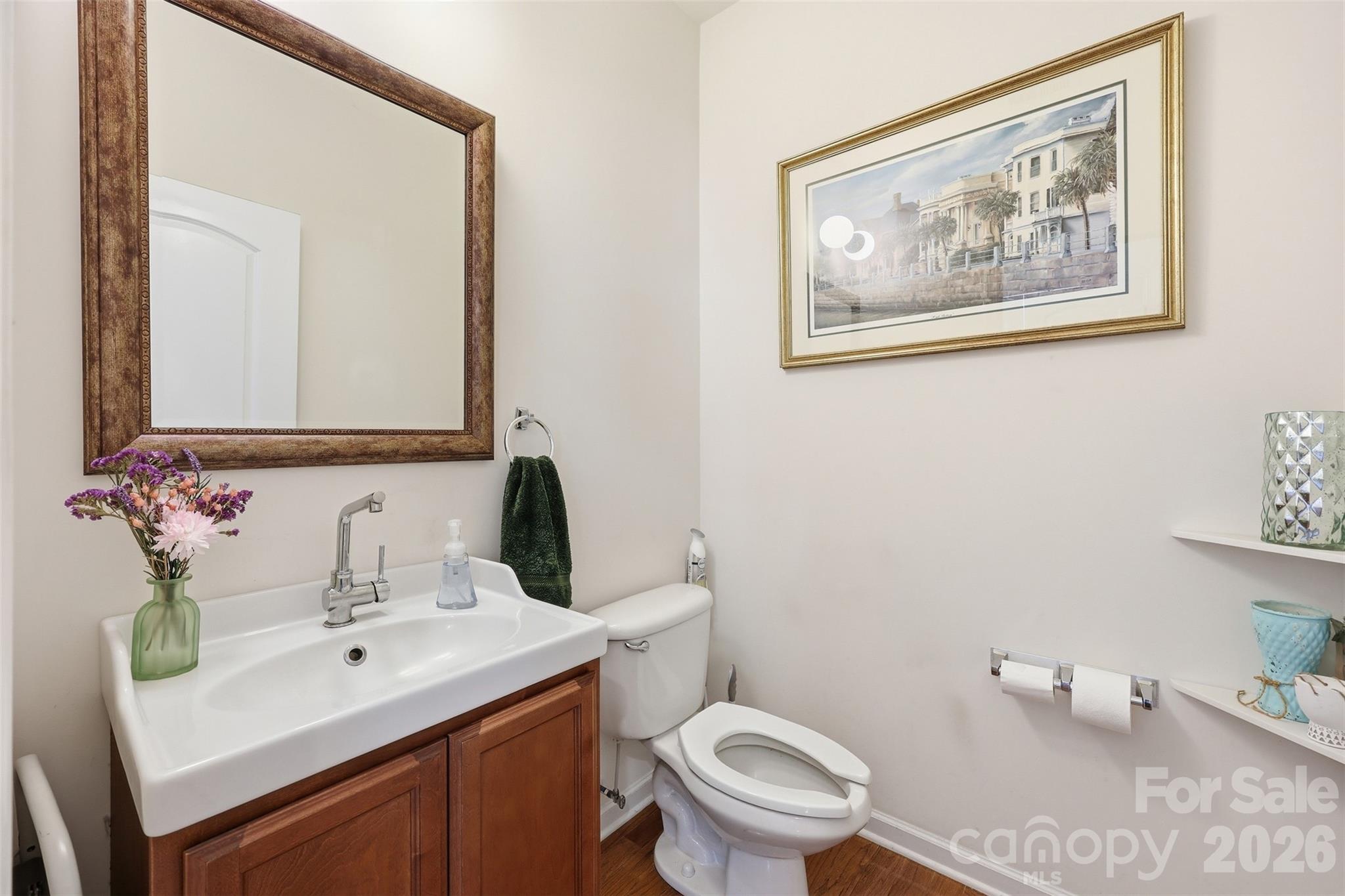 879 Ivy Trail Way Fort Mill, SC 29715 - Photo 8 of 44 a bathroom with a toilet sink and mirror