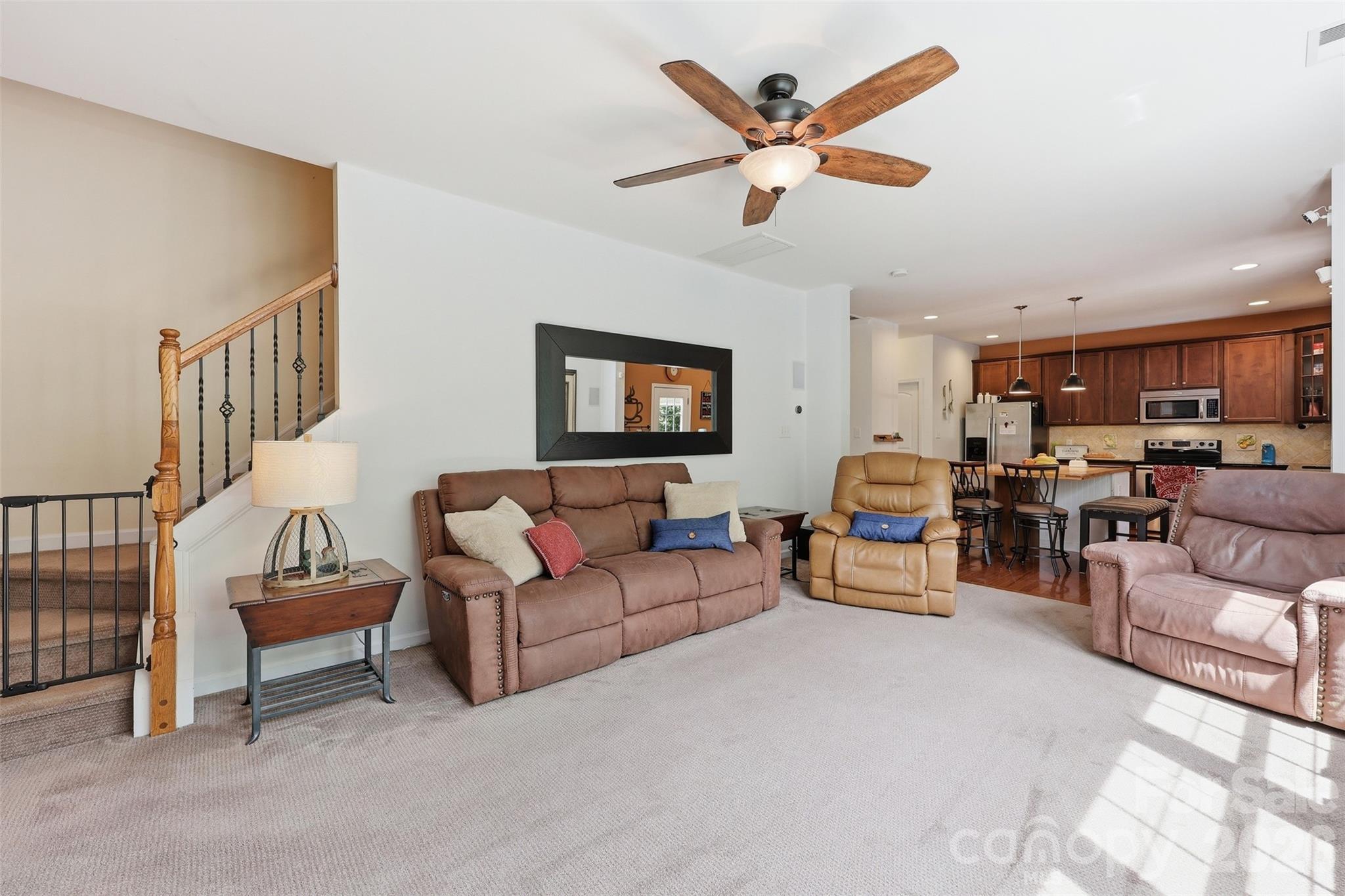879 Ivy Trail Way Fort Mill, SC 29715 - Photo 10 of 44 a living room with furniture and a ceiling fan