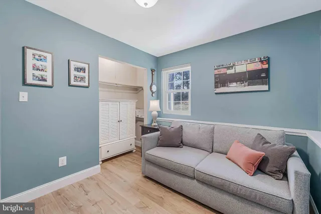 a view of a house with backyard porch and sitting area