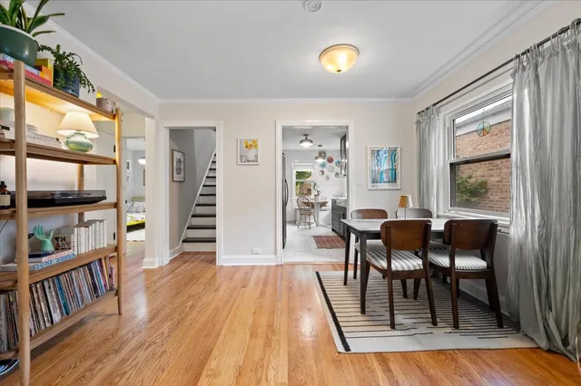 a view of a dining room with furniture and wooden floor