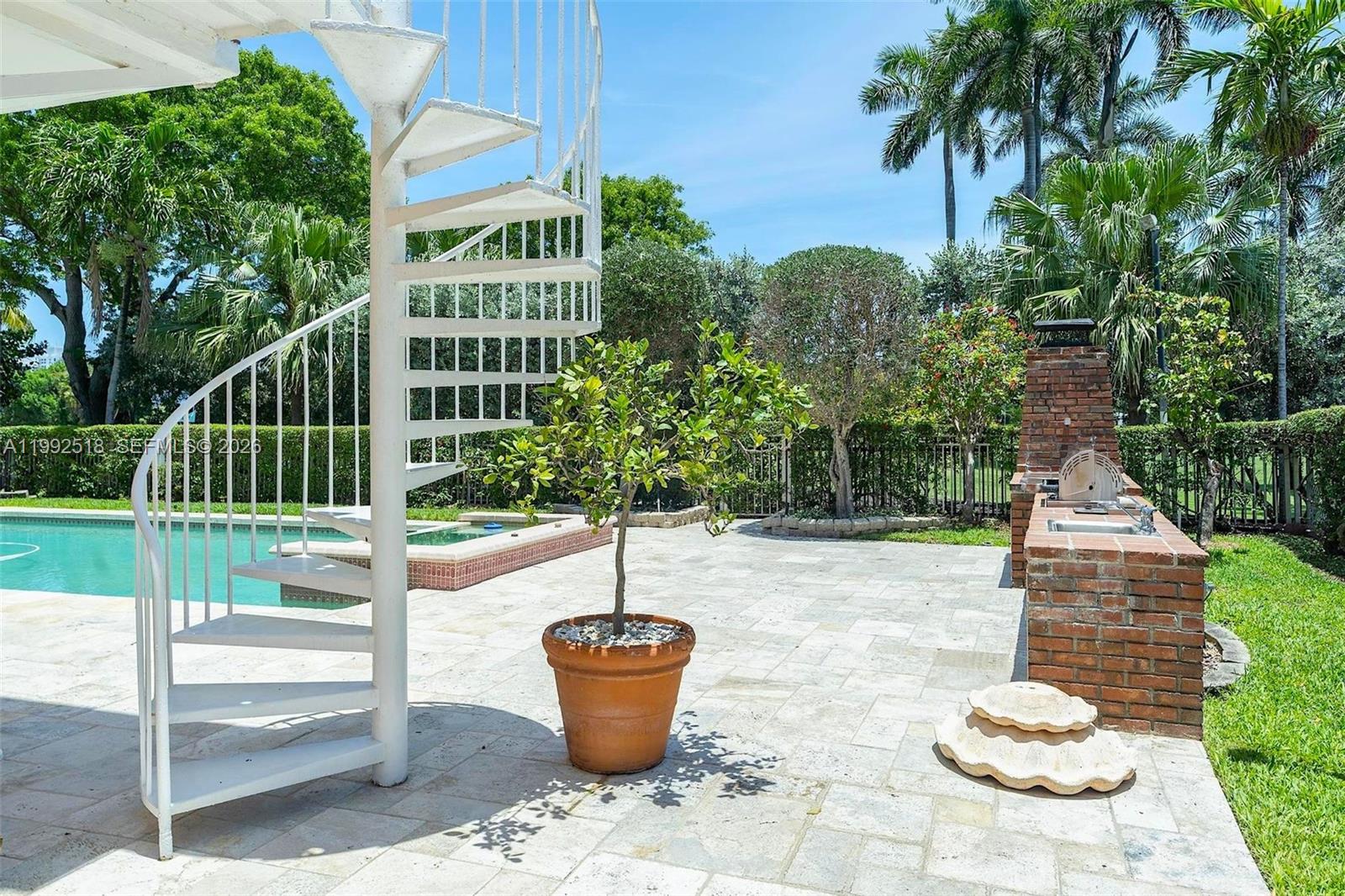 5309 Alton Road Miami Beach, FL 33140 - Photo 39 of 51 a view of a house with backyard and sitting area