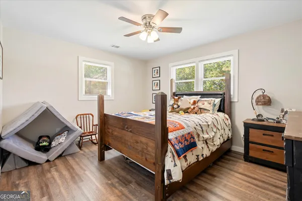 a bedroom with a bed and a tv