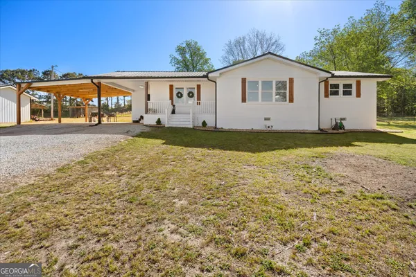 a view of front of house with a yard