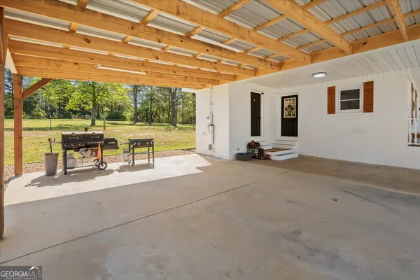 a view of a swimming pool with a patio