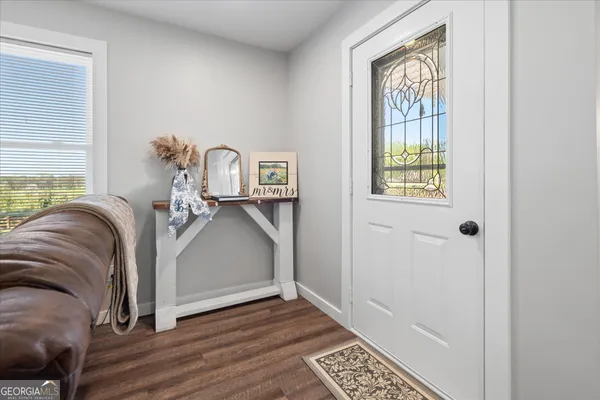 a view of livingroom with furniture and window