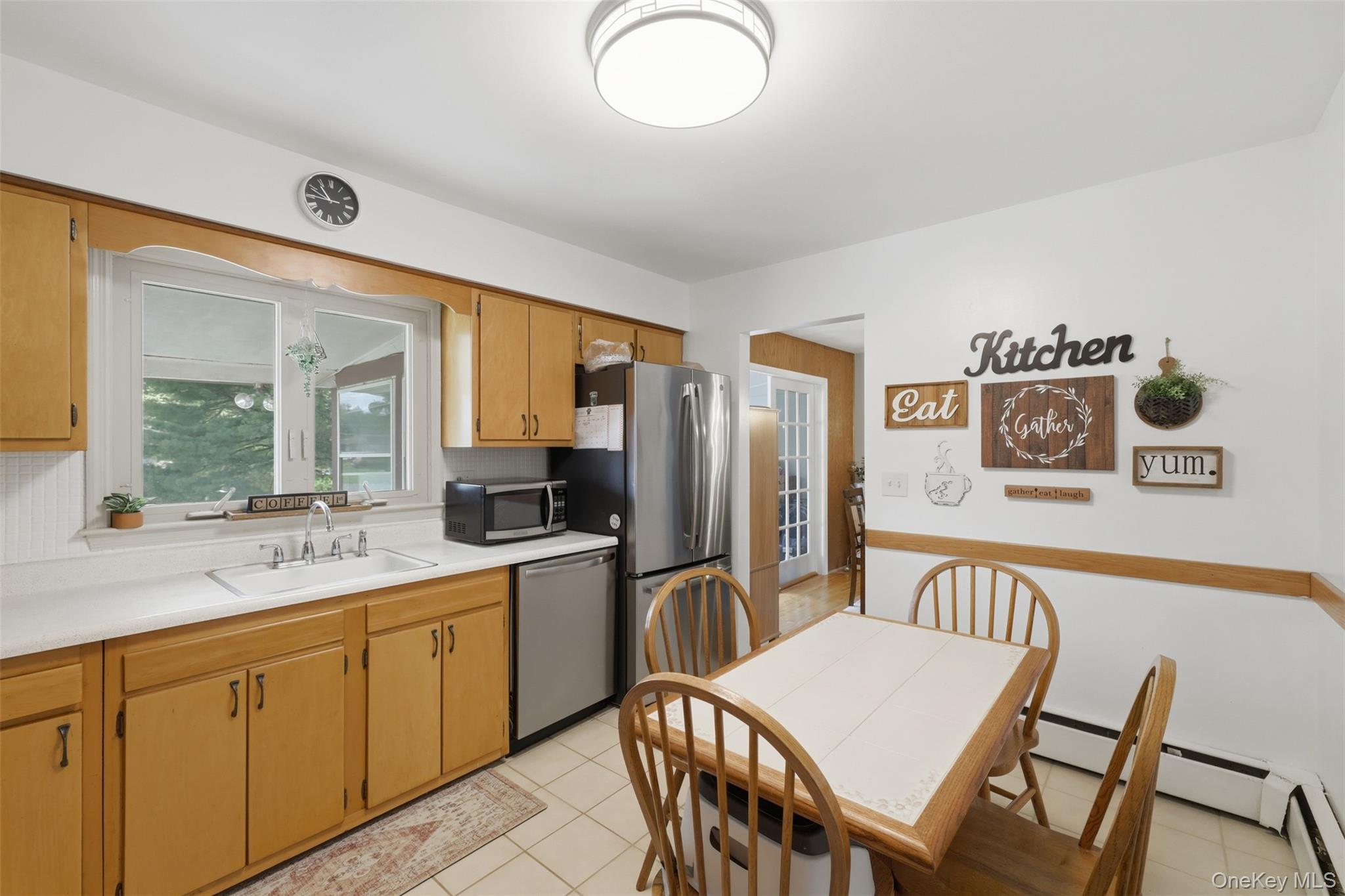 24 Beatty Road Wappingers Falls, NY 12590 - Photo 12 of 36 a large white kitchen with a table and chairs