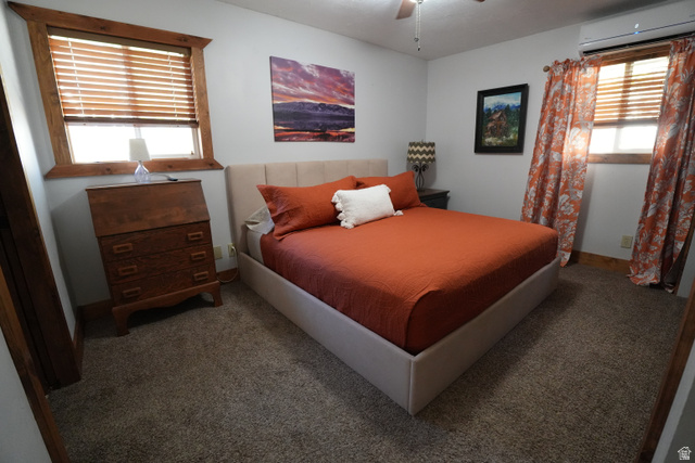 3711 North Canyon Road Provo, UT 84604 - Photo 11 of 42 Carpeted bedroom featuring a wall mounted AC and ceiling fan