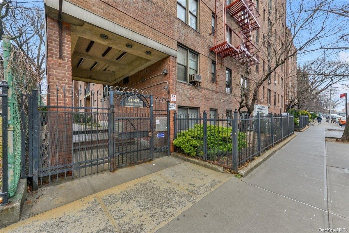 141-05 Northern, Unit C1D1 Queens, NY 11354 - Photo 3 of 17 a view of a pathway with a building in the background