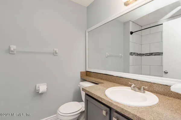 a bathroom with a sink toilet and vanity