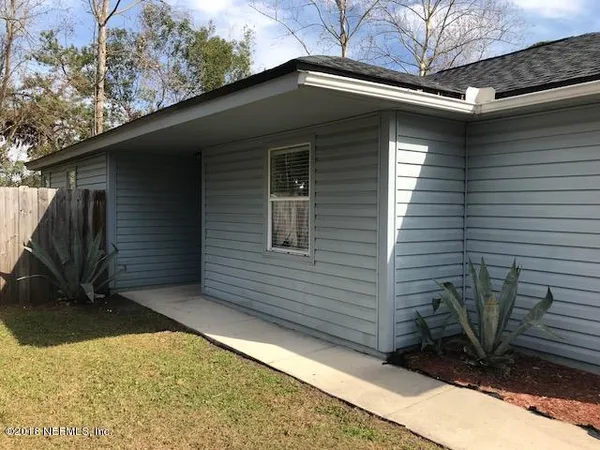 a front view of a house with a garage