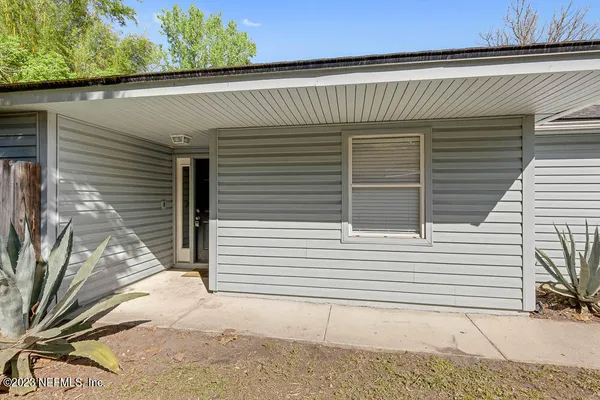 a view of a house with a door and wooden floor