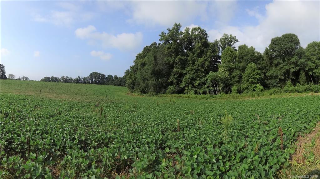 0 Allen Road Harmony, NC 28634 - Photo 5 of 17 a view of a green field with wooden fence