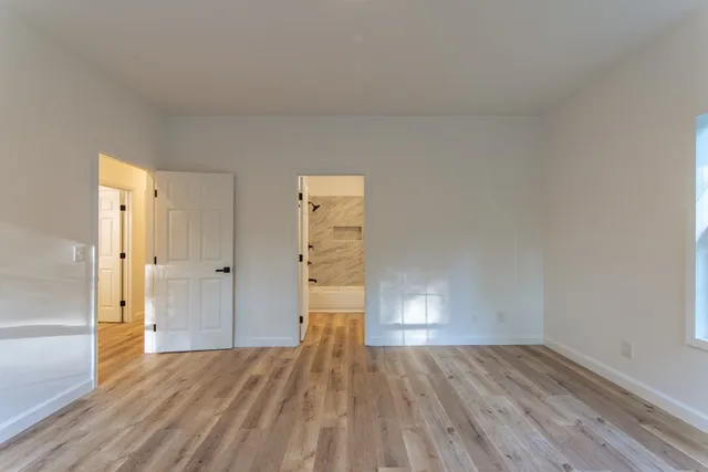 a bathroom with a bathtub and shower